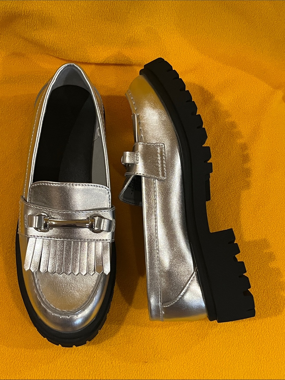Chunky Platform Heel Loafers w/ fringe kiltie flap & rugged lug sole. Silver. 7